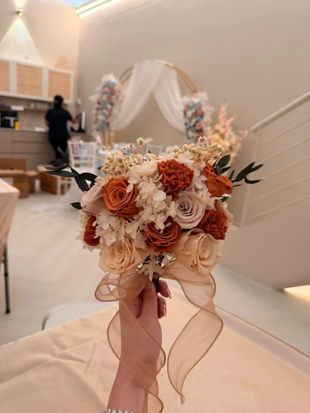 Dried flower bouquet in rust and cream
