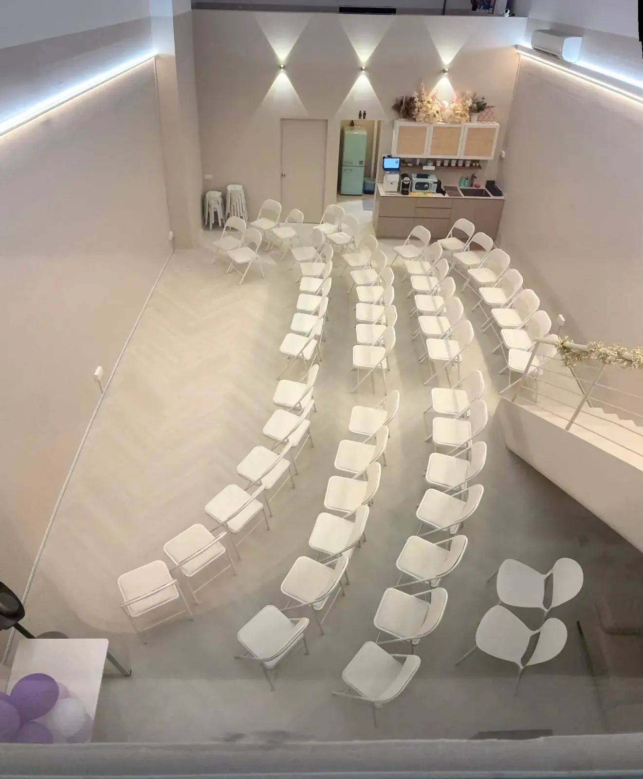 Chairs set in curved rows, seen from above